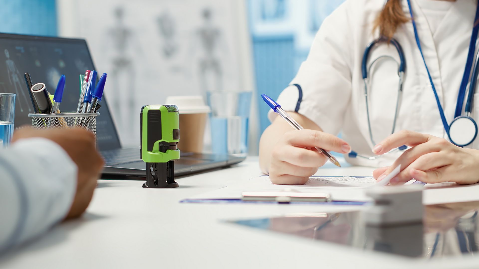 general-practitioner-putting-his-stamp-prescription-document.jpg